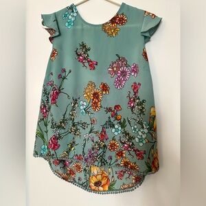 Adorable sleeveless top floral print embroidered hem bow tie back